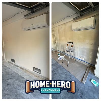 Garage wall patched, primed and repainted around a mini-split unit